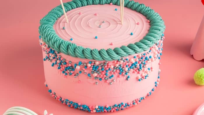 How do you get sprinkles on the bottom of a cake